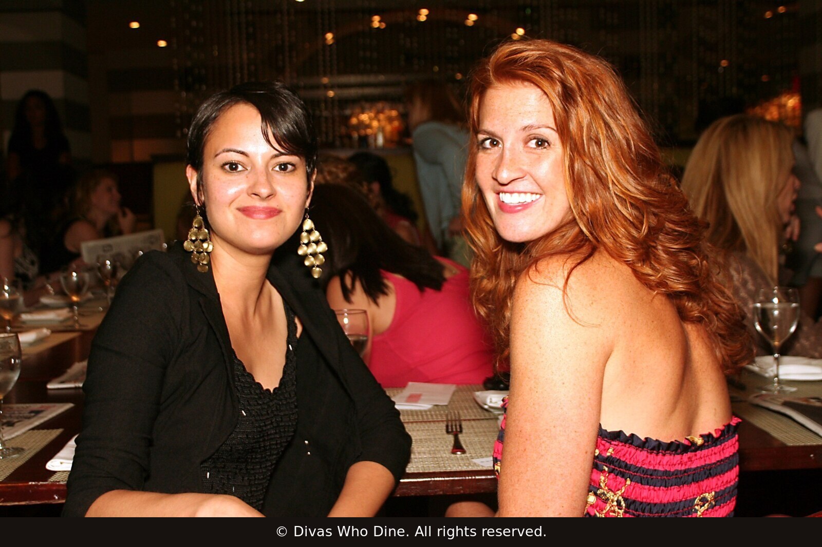 Two women smiling at a Divas Who Dine gathering in New York City in June 2006